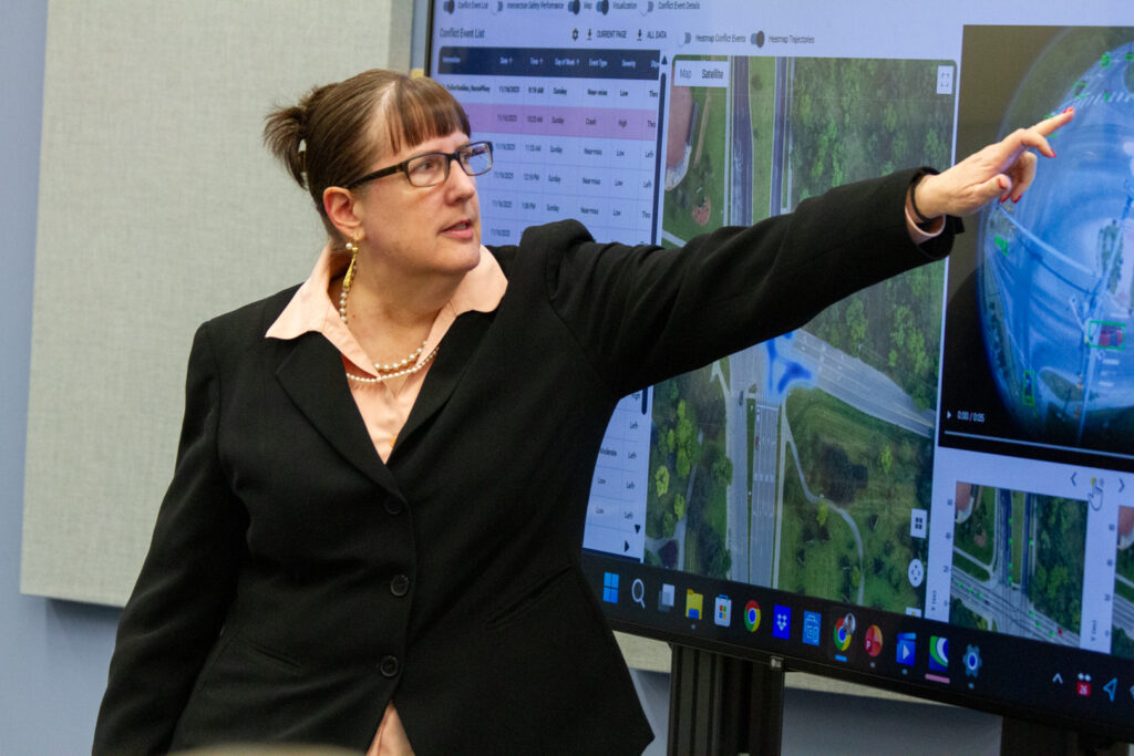 Debby Bezzina points to a screen during the 2026 NHTSA Visit