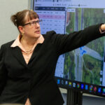 Debby Bezzina points to a screen during the 2026 NHTSA Visit